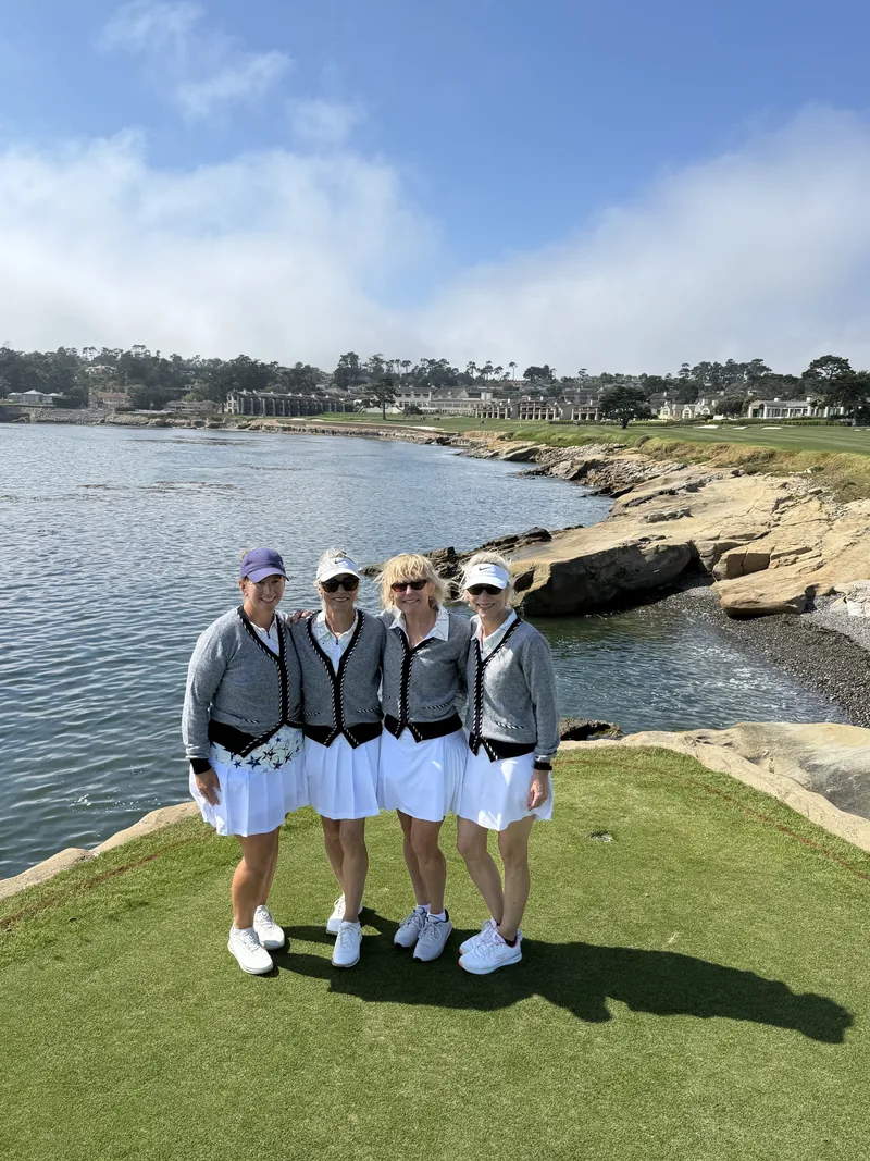 A ladies adventure group posing together on a landmark course